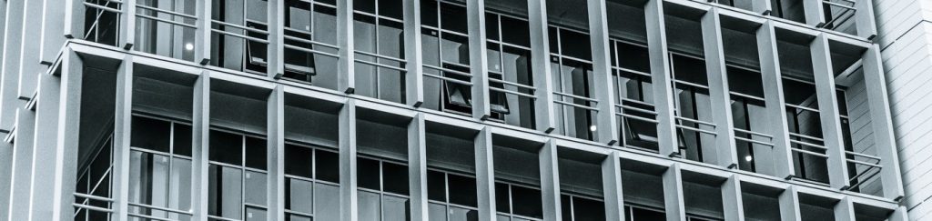 The window grid of a high-rise building filling the frame